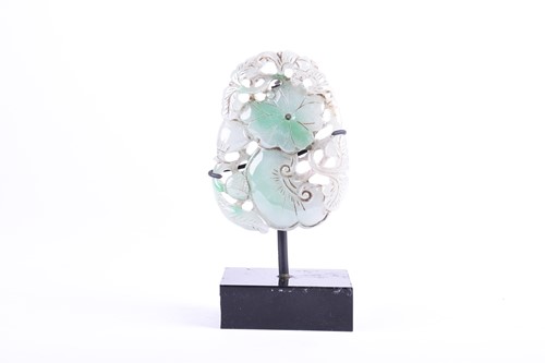 Lot 199 - A Chinese jade pendant, carved as a bat above...