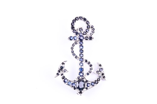 Lot 656 - A silver and sapphire anchor brooch, set with...