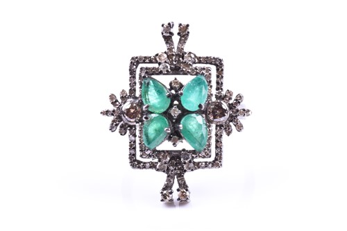 Lot 657 - An unusual silver, diamond, and emerald...
