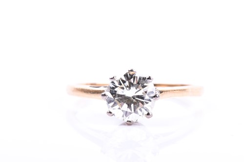 Lot 665 - An 18ct yellow gold and solitaire diamond ring,...