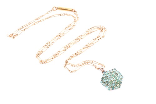 Lot 674 - A 9ct yellow gold and emerald pendant, of...