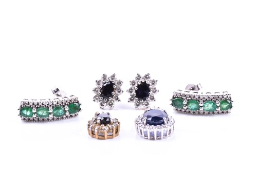 Lot 682 - A pair of 9ct white gold and emerald earrings,...