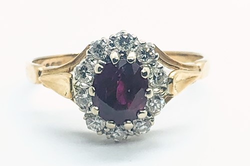 Lot 581A - An 18ct yellow gold, diamond, and ruby cluster...