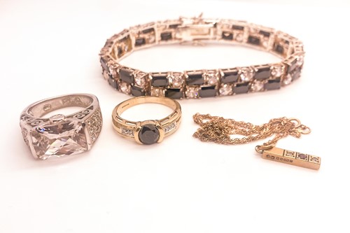 Lot 746 - A 9ct yellow gold and black CZ ring, together...