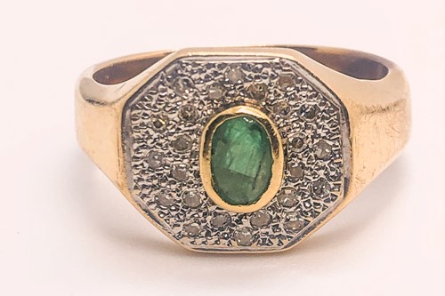 Lot 747 - A yellow gold, diamond, and emerald ring, set...