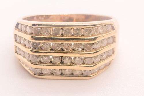 Lot 756 - A 9ct yellow gold and diamond ring, set with...