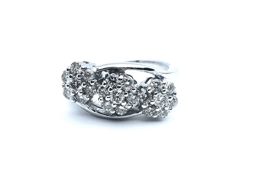 Lot 757 - An 18ct white gold and diamond crossover ring,...