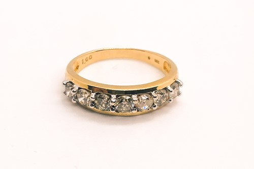 Lot 758 - An 18ct yellow gold and diamond ring, the...