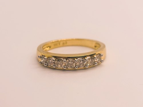 Lot 765 - A diamond ring, set with seven round-cut...
