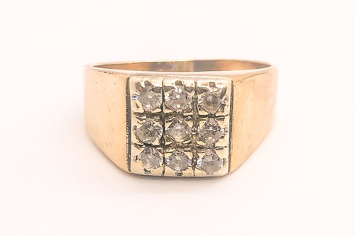 Lot 767 - A 9ct yellow gold and cubic zirconia gents...