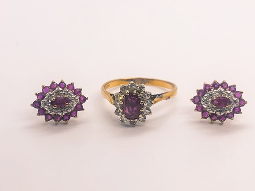 Lot 773 - An 18ct yellow gold, diamond, and ruby cluster...