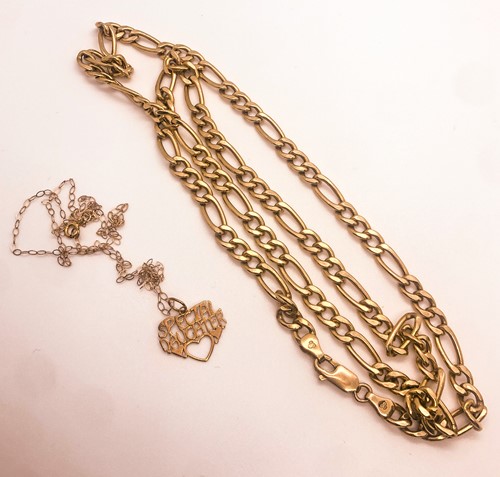 Lot 774 - A 9ct yellow gold flattened Figaro-link chain...
