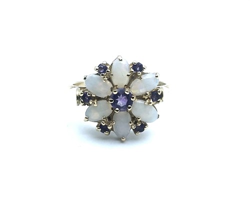 Lot 775 - A 9ct yellow gold, opal, and amethyst floral...