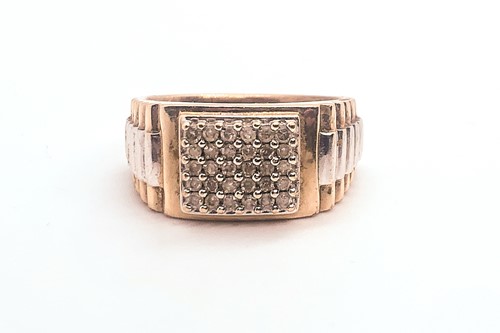 Lot 785 - A 9ct yellow and white gold gents ring, inset...