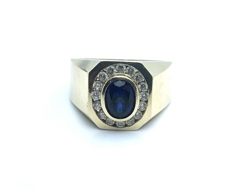 Lot 788 - A 14ct yellow gold and cz gents ring, set with...