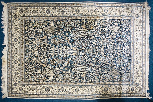 Lot 270 - A 20th century Nain rug with flowering shrub...
