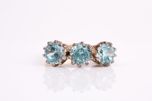 Lot 264 - A 9ct yellow gold and blue zircon ring, set...