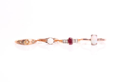 Lot 206 - A yellow metal, diamond, and ruby ring, set...