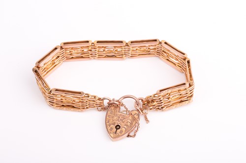 Lot 222 - A yellow metal gate-link bracelet, the...