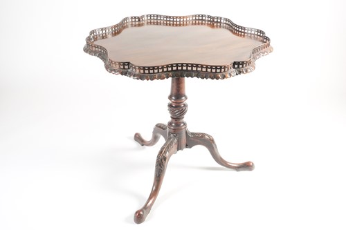 Lot 255 - A late George III, mahogany flip-top tripod...
