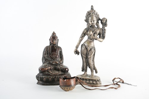 Lot 176 - A brown patinated bronze, seated Buddha on a...