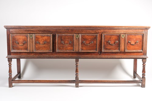 Lot 89 - A Charles II style oak dresser base with three...