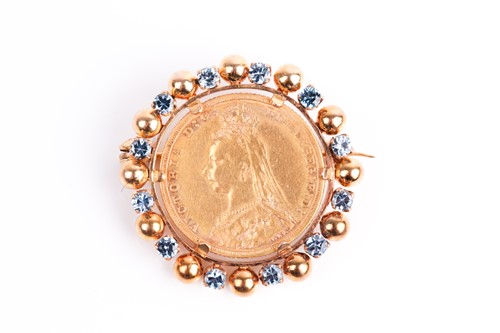 Lot 8 - A yellow metal mounted sovereign brooch, set...