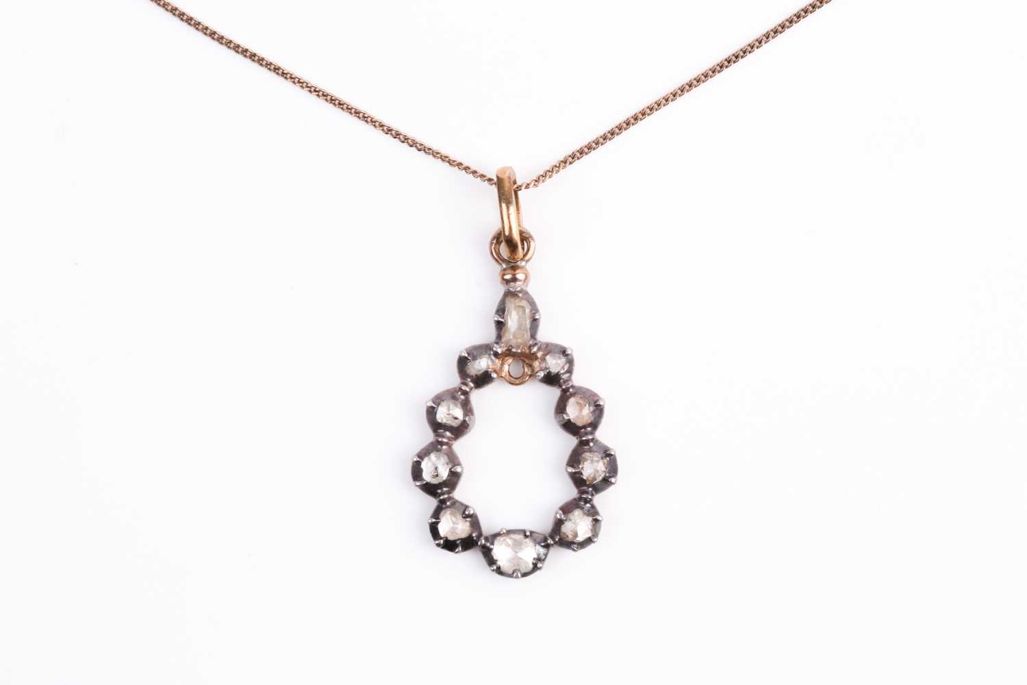 Lot 124 - A silver gilt and diamond pendant, the...
