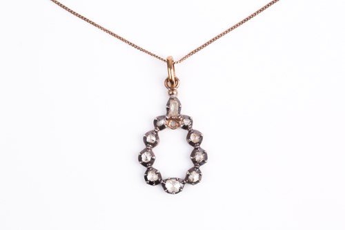 Lot 124 - A silver gilt and diamond pendant, the...