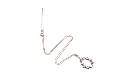 Lot 124 - A silver gilt and diamond pendant, the...