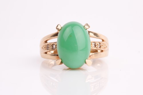 Lot 108 - A jade and diamond ring, the oval jade...