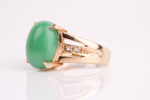 Lot 108 - A jade and diamond ring, the oval jade...