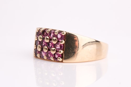 Lot 111 - A rectangular pink tourmaline cluster ring, in...