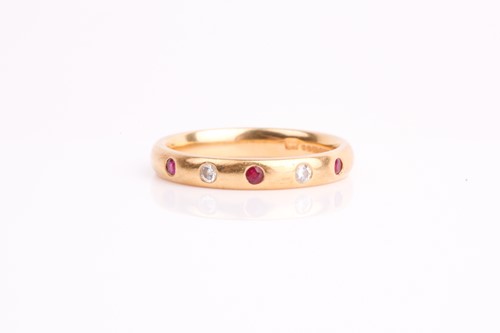Lot 212 - A diamond and ruby half eternity ring, the...