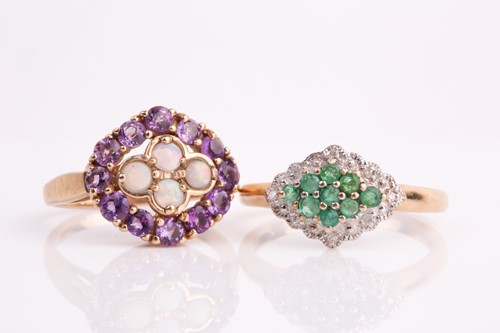 Lot 244 - An emerald and diamond cluster ring,...
