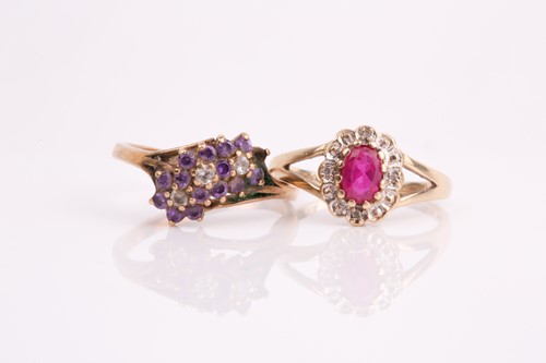 Lot 189 - A ruby and diamond oval cluster ring together...