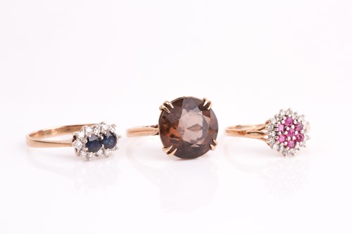 Lot 115 - A ruby and diamond cluster ring, a two stone...