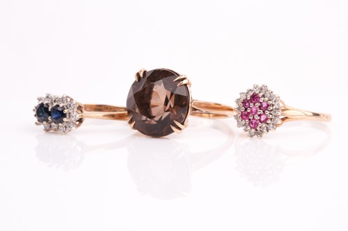 Lot 115 - A ruby and diamond cluster ring, a two stone...