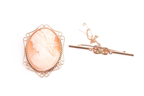 Lot 415 - A shell cameo brooch, depicting a side profile...