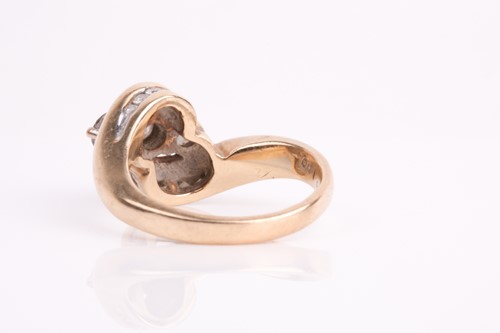 Lot 62 - A three stone diamond crossover ring, the...