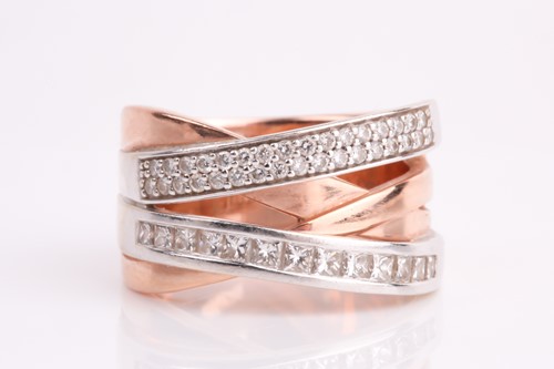 Lot 43 - A two colour, four row, diamond set cross-over...