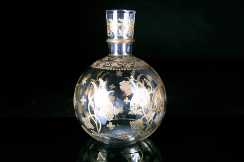 Lot 426 - A circa 1900 clear glass bottle vase, of...