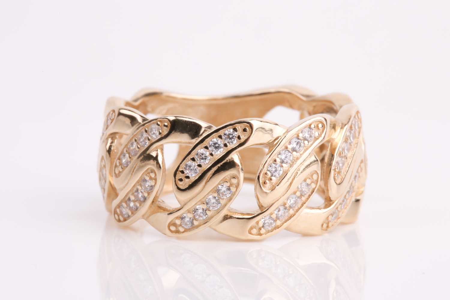 Lot 113 - A yellow metal and CZ ring, the mount of a...