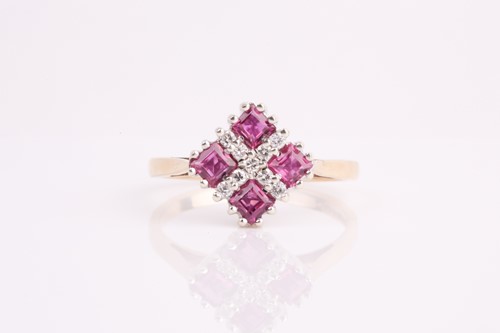 Lot 259 - A 9ct yellow gold, diamond, and red stone ring,...