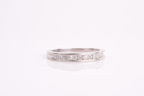 Lot 178 - A diamond half-eternity ring, channel-set with...