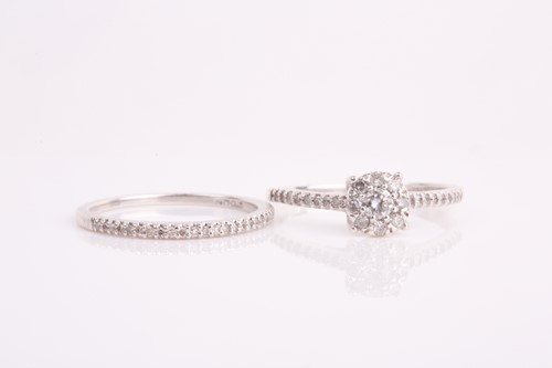Lot 36 - A silver and diamond cluster engagement style...