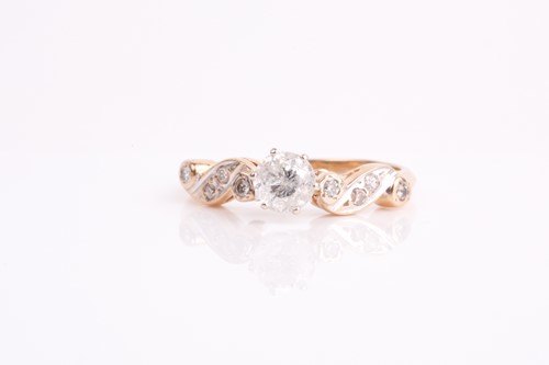 Lot 150 - A yellow metal and diamond ring, set with a...