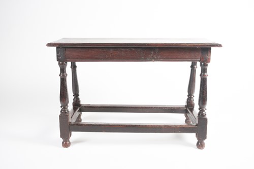 Lot 131 - A part 17th century oak long stool with 'thumb'...
