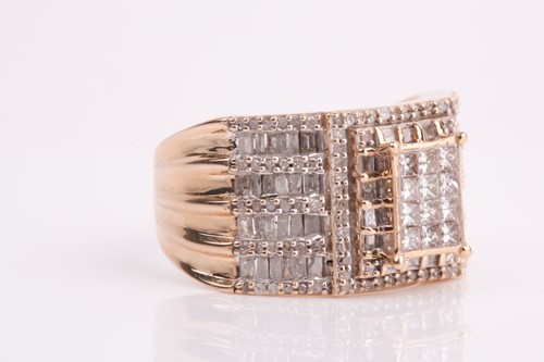 Lot 93 - A yellow metal and diamond ring, calibre-set...