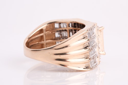 Lot 93 - A yellow metal and diamond ring, calibre-set...
